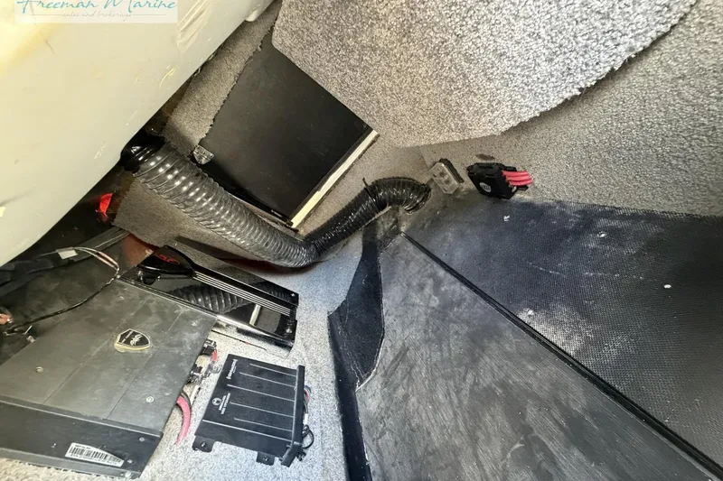 Slide: The Image of Interior view of a 2019 Malibu Wakesetter 24 MXZ boat showing wiring and components. - 21