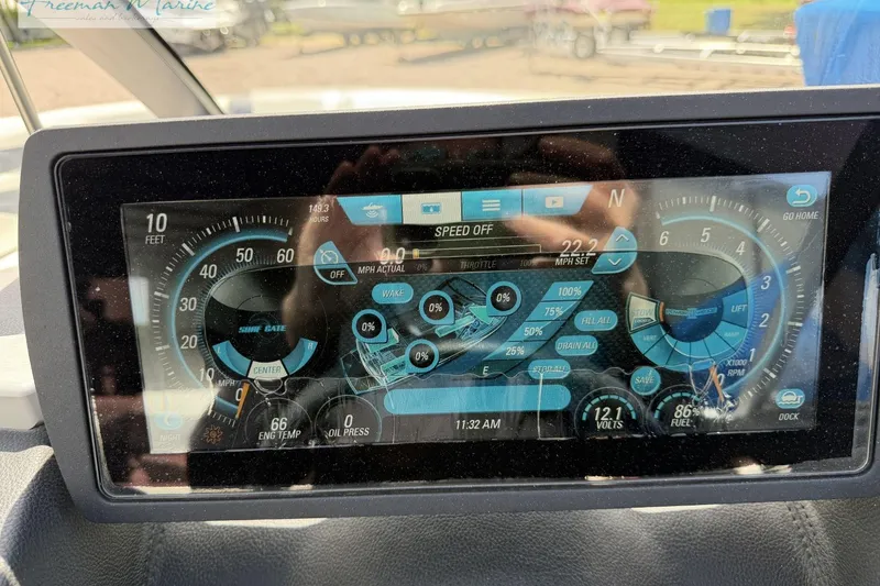 Slide: The Image of Dashboard display of a 2019 Malibu Wakesetter 24 MXZ boat, showing speed and engine metrics. - 25
