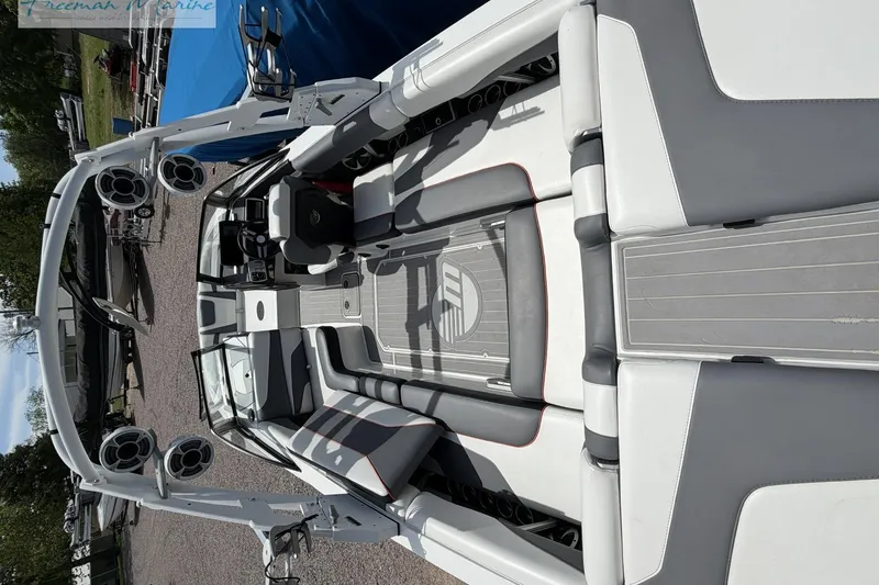 Slide: The Image of 2019 Malibu Wakesetter 24 MXZ interior with sleek seating and advanced audio system. - 7