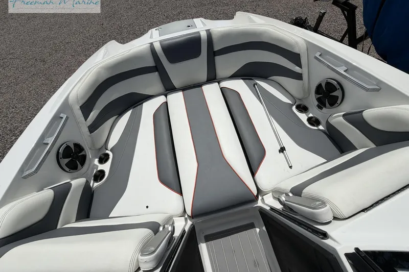 Slide: The Image of Interior of a 2019 Malibu Wakesetter 24 MXZ boat with stylish seating and speakers. - 8