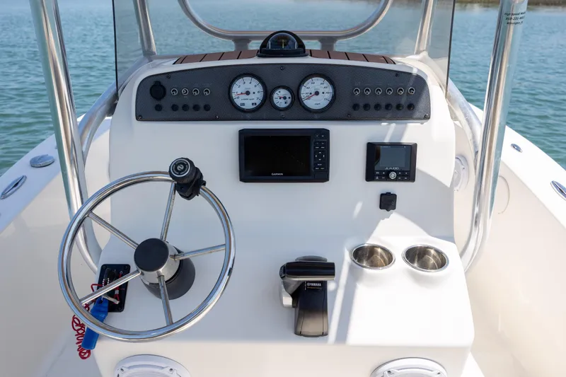 Slide: The Image of Control panel of 2019 Pioneer 180 Islander boat with steering wheel and gauges. - 14