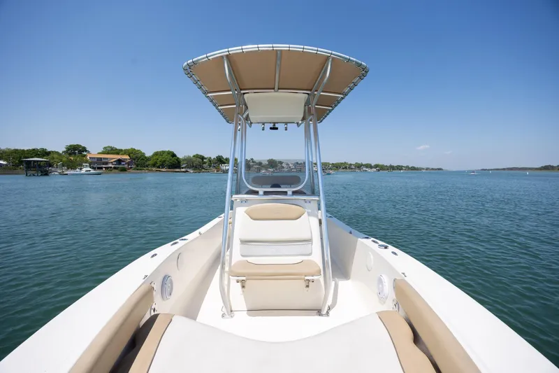 Slide: The Image of 2019 Pioneer 180 Islander boat on calm water with clear blue sky. - 9