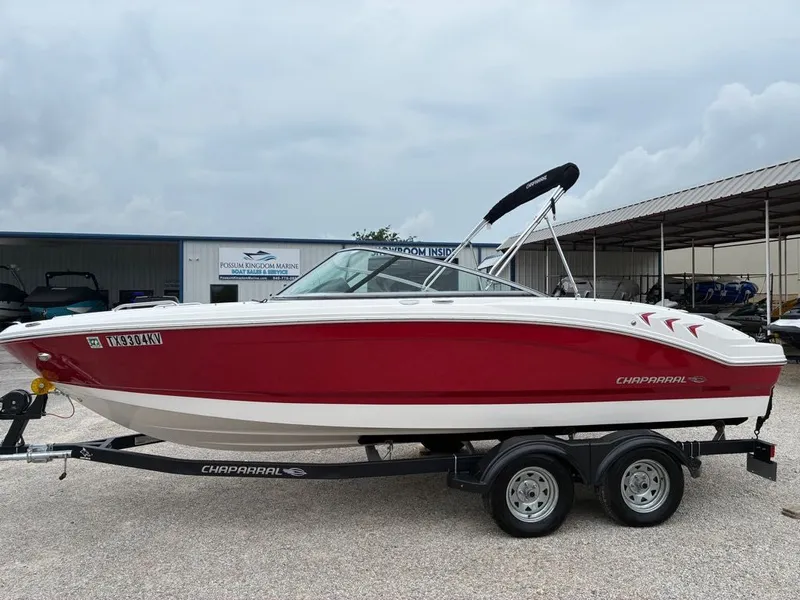 The Image of Red 2023 Chaparral 21 SSI Sport boat on trailer. - 1