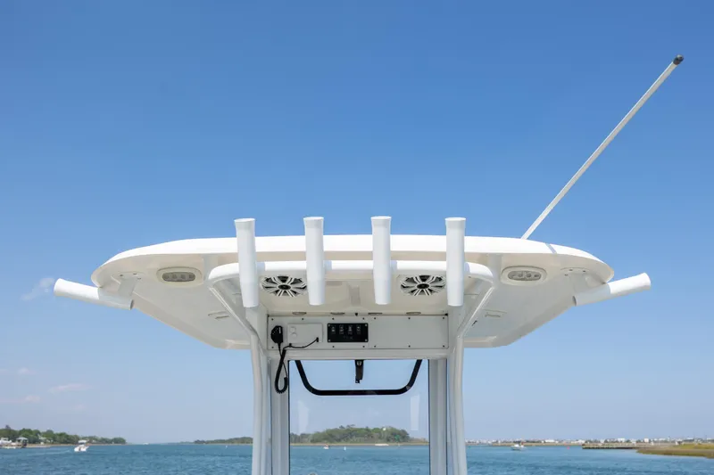 Slide: The Image of 2018 Sea Hunt Ultra 235 SE boat top view with rod holders and antenna against blue sky. - 20