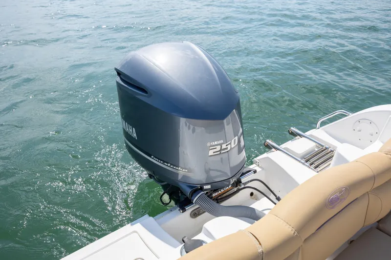 Slide: The Image of 2018 Sea Hunt Ultra 235 SE boat with Yamaha 250 outboard motor on water. - 23