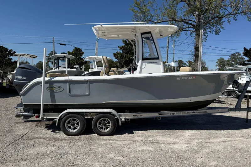 Slide: The Image of 2018 Sea Hunt Ultra 235 SE boat on trailer, side view, outdoors. - 28