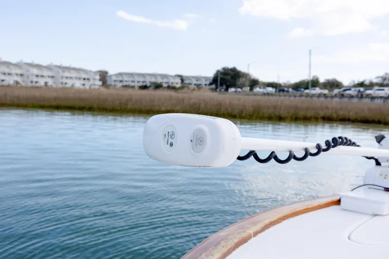 Slide: The Image of 2017 Chaos 21 Tarpon Bay boat with trolling motor on calm water. - 13