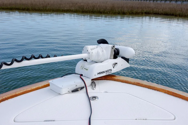 Slide: The Image of Minn Kota Ulterra trolling motor on 2017 Chaos 21 Tarpon Bay boat, calm water background. - 18