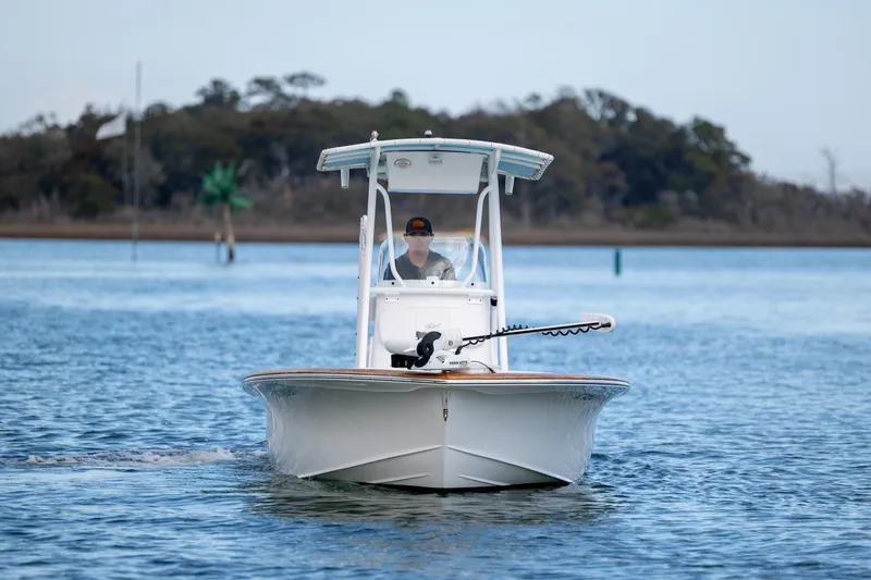 Slide: The Image of 2017 Chaos 21 Tarpon Bay boat cruising on calm water with scenic background. - 3