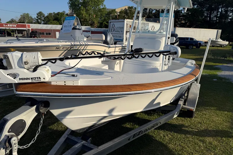 Slide: The Image of 2017 Chaos 21 Tarpon Bay boat on trailer, featuring Minn Kota trolling motor. - 31