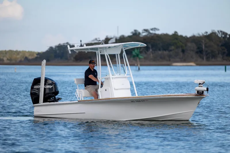 Slide: The Image of 2017 Chaos 21 Tarpon Bay boat cruising on calm water with Mercury engine. - 4