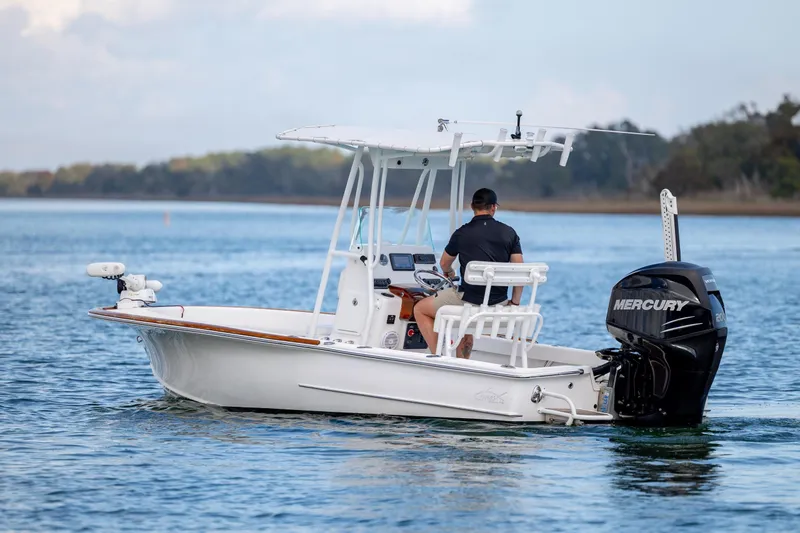 Slide: The Image of 2017 Chaos 21 Tarpon Bay boat cruising on calm water with Mercury engine. - 6