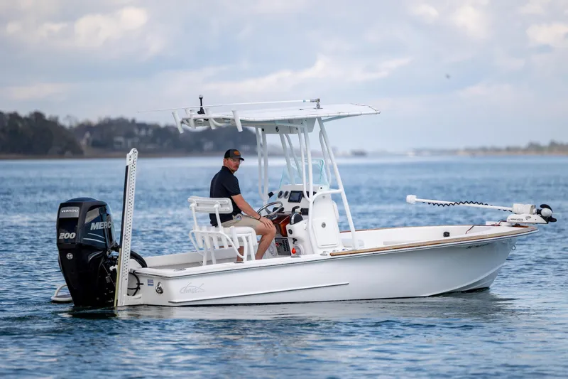 Slide: The Image of 2017 Chaos 21 Tarpon Bay boat on water, featuring a Mercury 200 engine. - 8