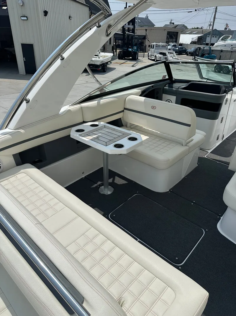 Slide: The Image of Interior of a 2021 Cobalt 30SC boat with seating area and table. - 6