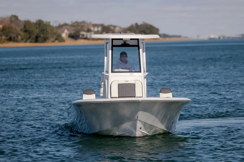 Slide: The Image of 2024 Tidewater 2500 Carolina Bay boat cruising on calm waters. - 3