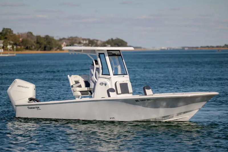 Slide: The Image of 2024 Tidewater 2500 Carolina Bay boat cruising on a calm lake. - 4