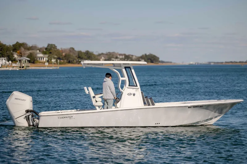 Slide: The Image of 2024 Tidewater 2500 Carolina Bay boat cruising on a calm waterway. - 6