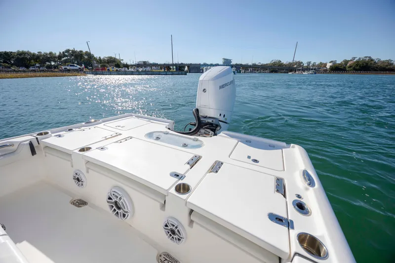 Slide: The Image of 2024 Tidewater 2500 Carolina Bay boat on water, featuring a Mercury outboard motor. - 9