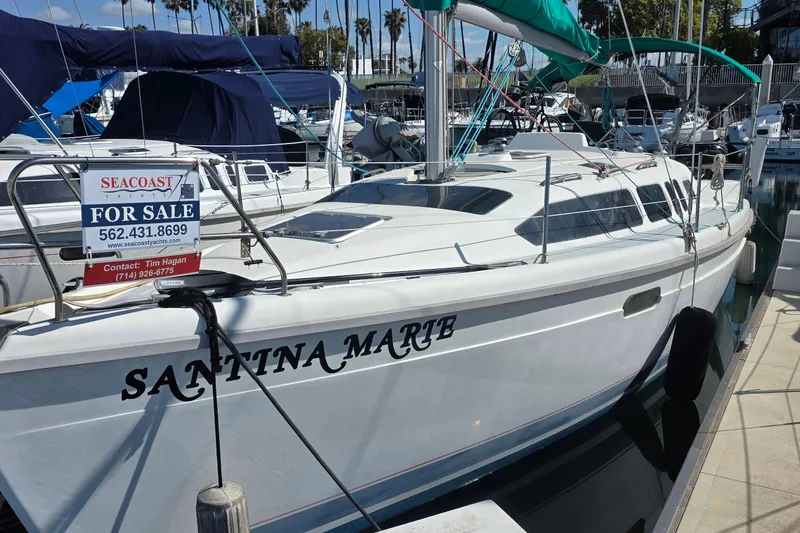 The Image of Hunter 336 sailboat from 1995, named "Santina Marie," docked and for sale. - 0