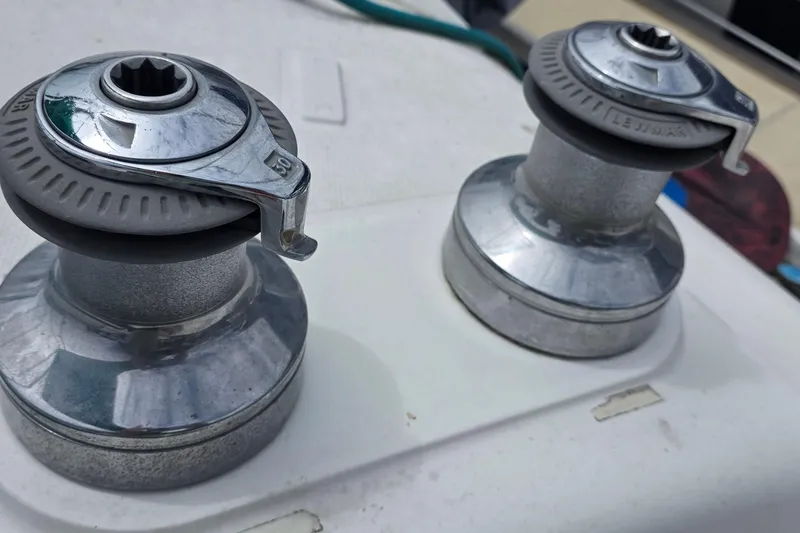 Slide: The Image of Close-up of two chrome winches on a 1995 Hunter 336 sailboat deck. - 22
