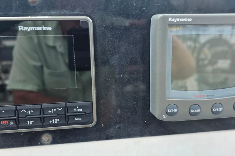 Slide: The Image of Raymarine navigation instruments on a 1995 Hunter 336 sailboat dashboard. - 23
