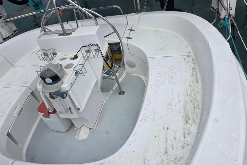 Slide: The Image of Cockpit of a 1995 Hunter 336 sailboat with seating and steering wheel. - 28