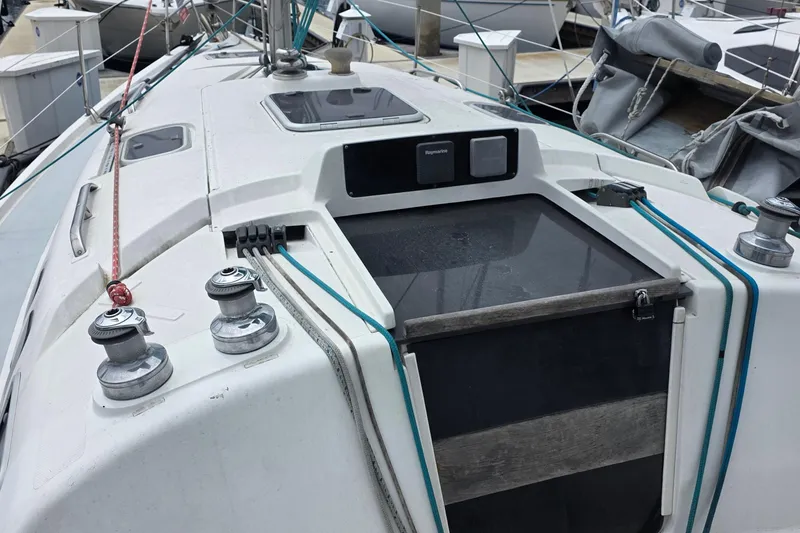 Slide: The Image of Sailboat deck of a 1995 Hunter 336, featuring winches and rigging lines. - 3