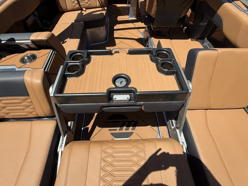 Slide: The Image of Interior of 2026 Malibu 26LSV with brown leather seats and table. - 10