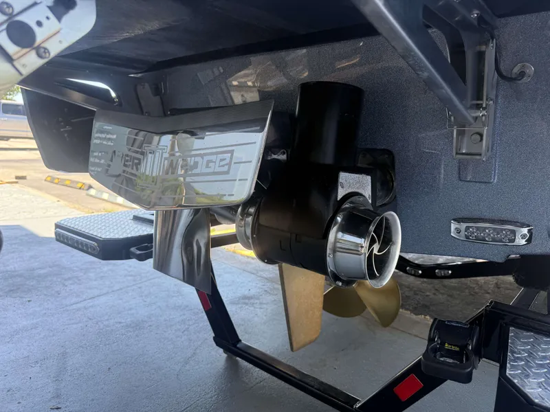 Slide: The Image of Rear view of a 2026 Malibu 26LSV with Surf Gate and propeller. - 35