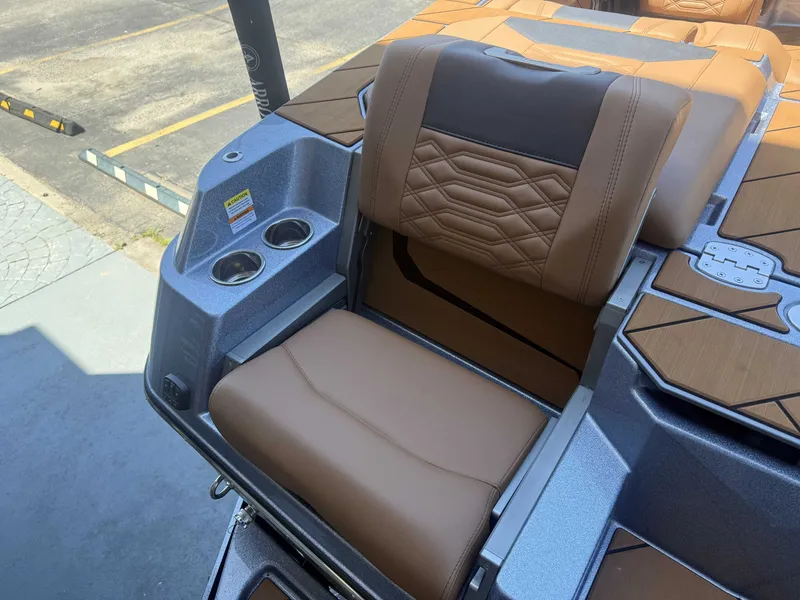 Slide: The Image of 2026 Malibu 26LSV boat seat with cup holders and upholstery. - 7