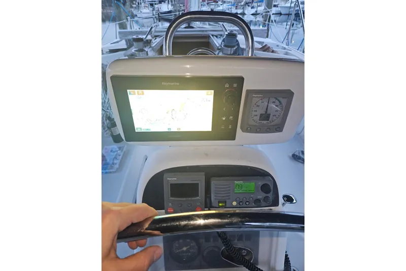 Slide: The Image of Cockpit of 1993 Hunter Vision 36 sailboat with navigation instruments and steering wheel. - 11
