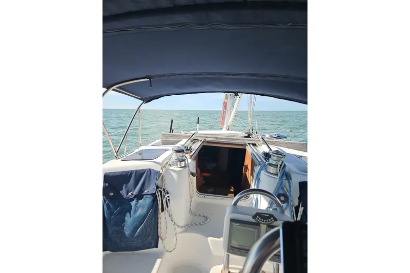Slide: The Image of Cockpit view of 1993 Hunter Vision 36 sailboat on open sea. - 3