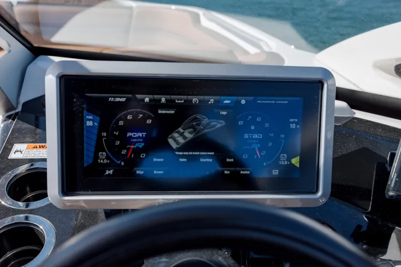 Slide: The Image of Dashboard of 2024 Yamaha Boats 275SD displaying digital controls and gauges. - 23