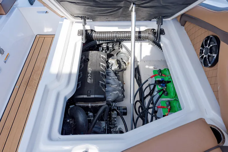 Slide: The Image of 2024 Yamaha Boats 275SD engine compartment with visible components and wiring. - 33