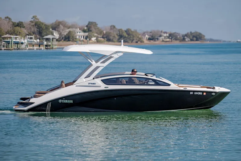 Slide: The Image of 2024 Yamaha Boats 275SD cruising on calm waters, showcasing sleek design and modern features. - 9