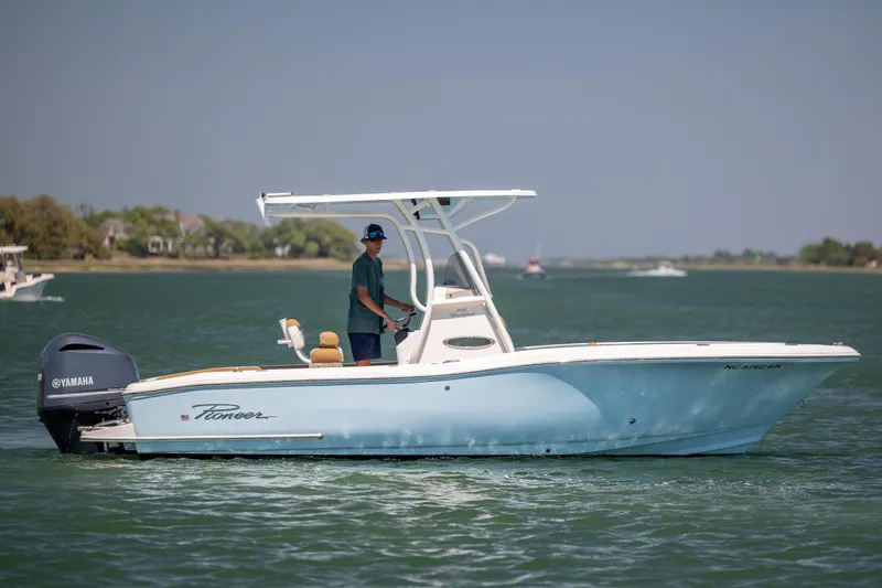The Image of 2019 Pioneer 222 Sportfish boat on water, featuring Yamaha outboard motor. - 1