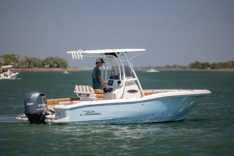 Slide: The Image of 2019 Pioneer 222 Sportfish boat on water, featuring Yamaha engine and sleek design. - 3