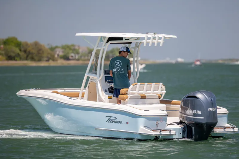 Slide: The Image of 2019 Pioneer 222 Sportfish boat with Yamaha engine cruising on a sunny day. - 6