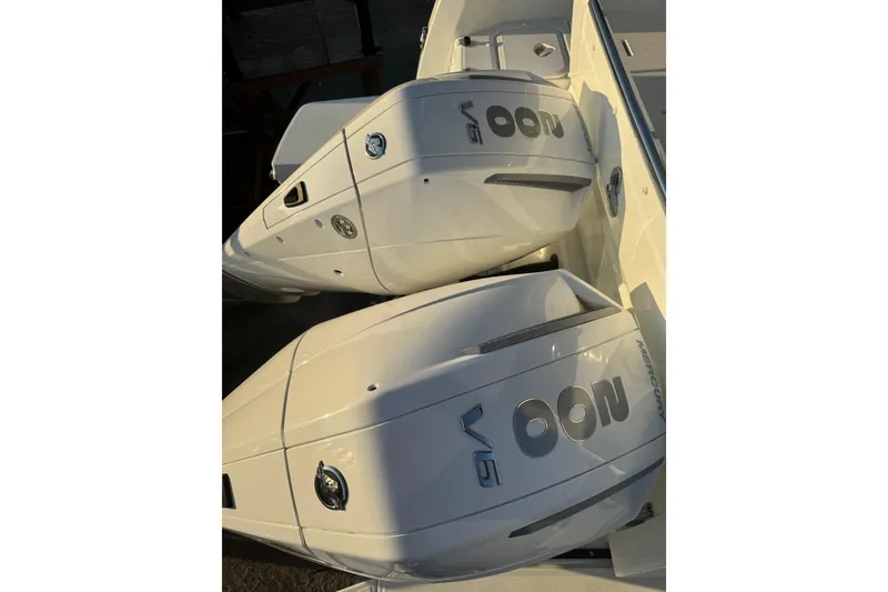 Slide: The Image of Twin Mercury outboard engines on a 2026 Beneteau Antares 9 V2 boat. - 2