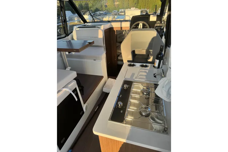 Slide: The Image of Interior of 2026 Beneteau Antares 9 V2 boat with modern kitchen amenities. - 3
