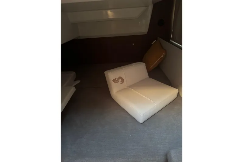 Slide: The Image of Interior cabin of 2026 Beneteau Antares 9 V2 with cushioned seating. - 6