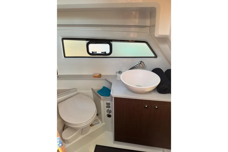 Slide: The Image of Bathroom interior of 2026 Beneteau Antares 9 V2 with modern sink and window. - 7