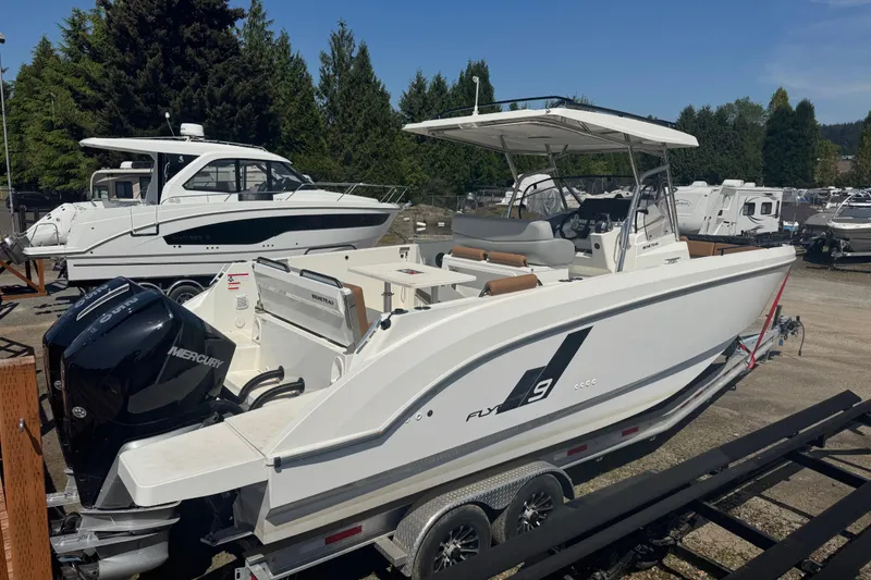 The Image of 2024 Beneteau Flyer 9 SPACEdeck boat on trailer, featuring Mercury outboard engine. - 1