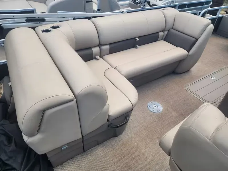 Slide: The Image of Interior of 2022 Sun Tracker 22 DLX with beige upholstery. - 11