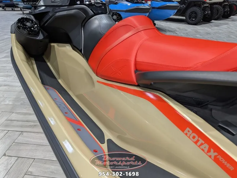 Slide: The Image of Sea-Doo RXT-X 325 2025 with red seat and Rotax Power branding. - 12