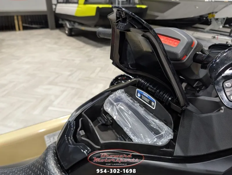 Slide: The Image of 2025 Sea-Doo RXT-X 325 with open storage compartment. - 14