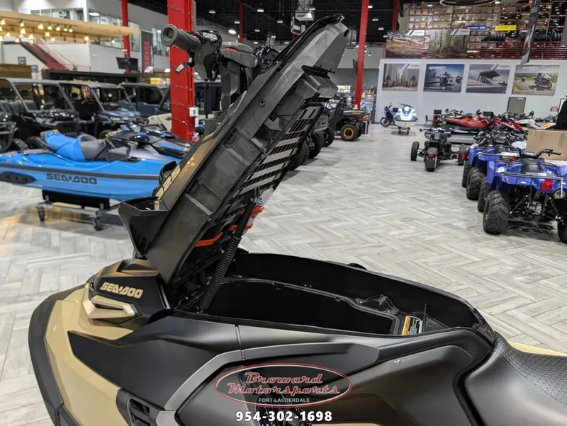 Slide: The Image of 2025 Sea-Doo RXT-X 325 jet ski with open storage in showroom. - 17