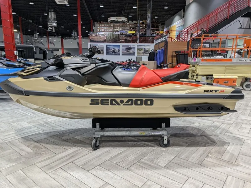 Slide: The Image of 2025 Sea-Doo RXT-X 325 jet ski in a showroom. - 25