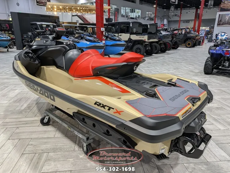 Slide: The Image of 2025 Sea-Doo RXT-X 325 jet ski in a showroom. - 6