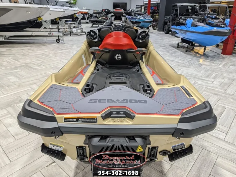 Slide: The Image of 2025 Sea-Doo RXT-X 325 jet ski in a showroom. - 7